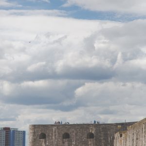 A cloudy sky hovers above the beach of the Hotwalls
