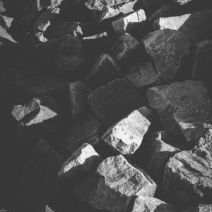 Black and white rocks bathed in light and shadow