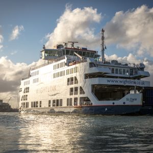 Sunlight lights up the Isle of Wight ferry as it arrives in Portsmouth